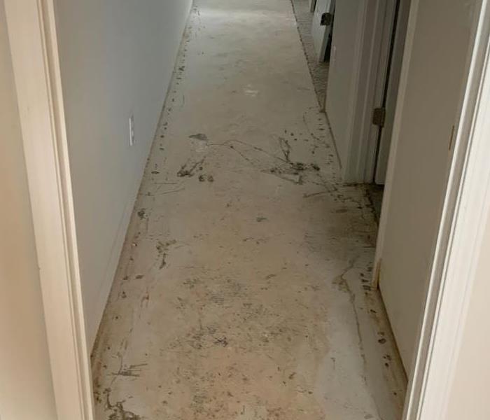 hallway post water mitigation and carpet removal 