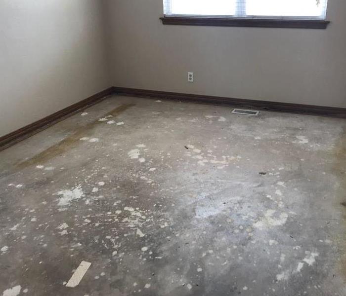 Bedroom with carpet removed after water damage