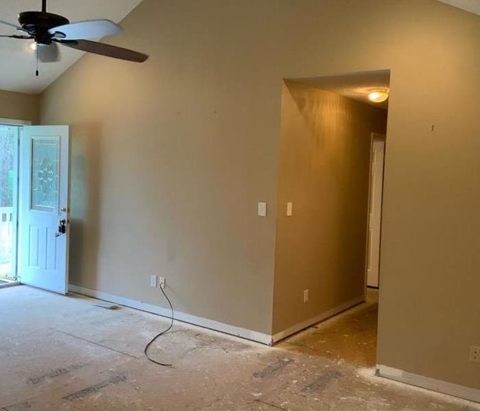 living room post water mitigation services