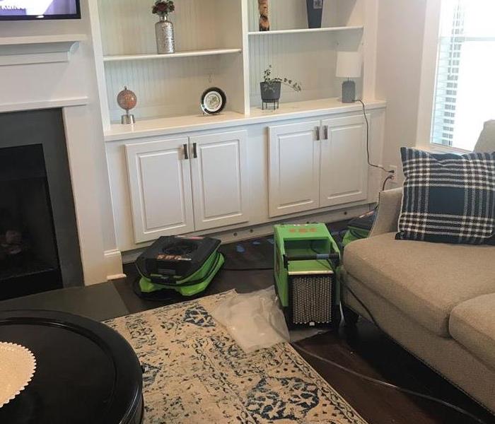 SERVPRO Green drying equipment placed in family room 