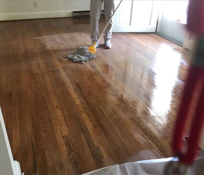 production member mopping residential building 
