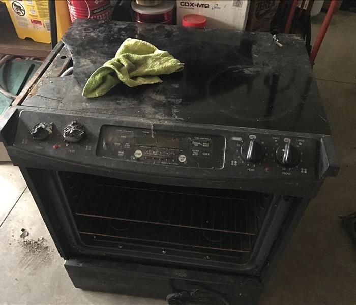 Photo of a stove that caught fire and caused a house fire